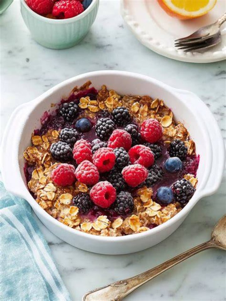 Baked oatmeal topped with berries.