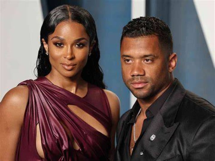 Ciara and Russell Wilson as Catwoman and Batman 