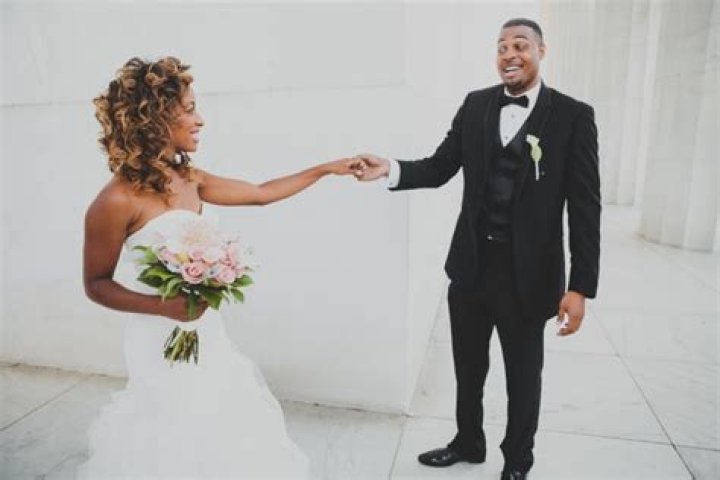 Jeannette Reyes in her wedding dress with boyfriend Robert Burton.