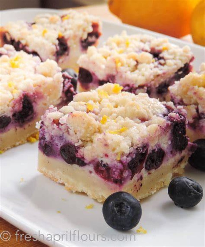 Lemon blueberry bar topped with white icing.