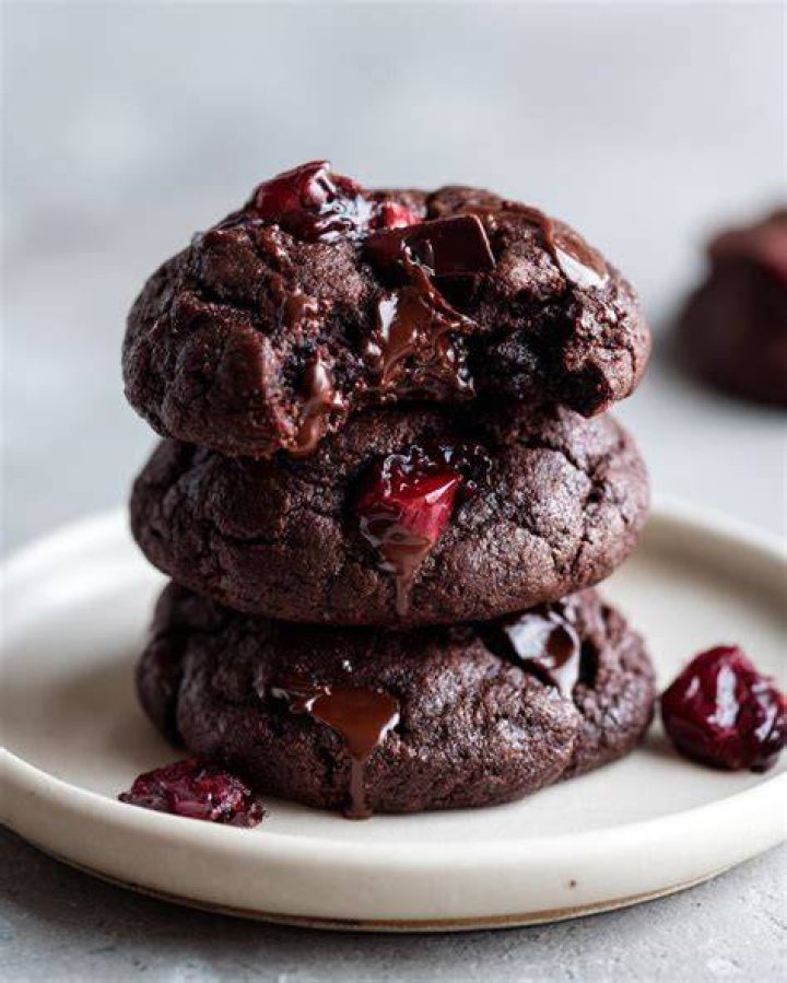 Stack of three chocolate cherry cookies.