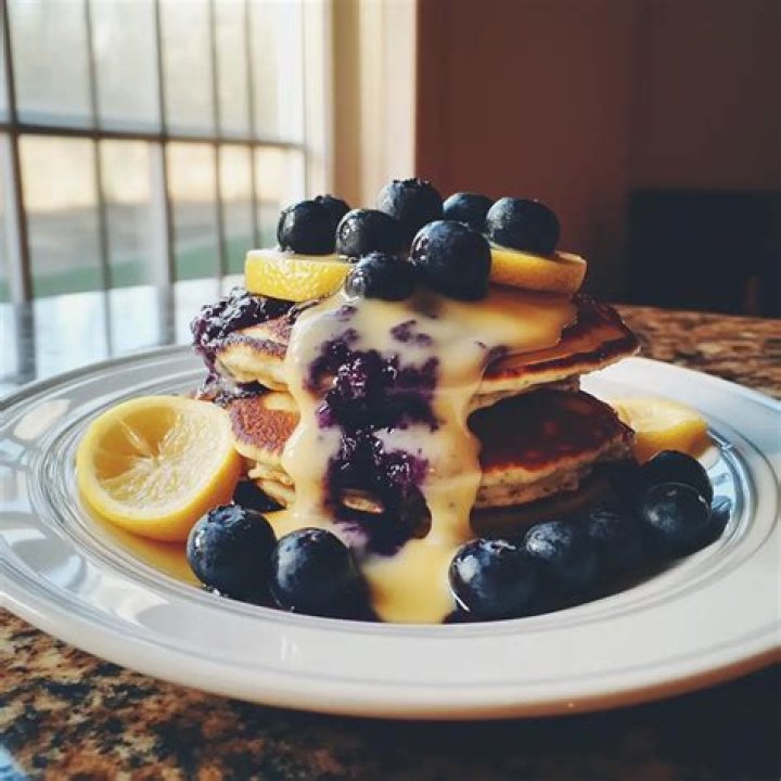 Stack of two lemon blueberry bars.