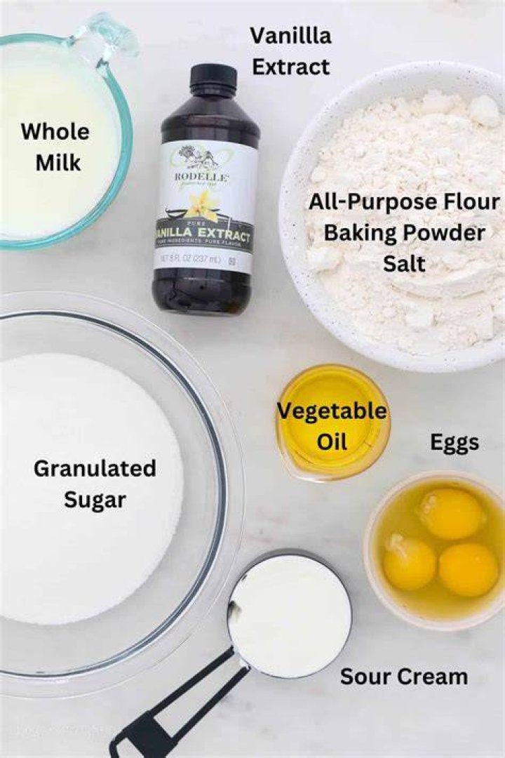 Vanilla cake batter ingredients in a white bowl.