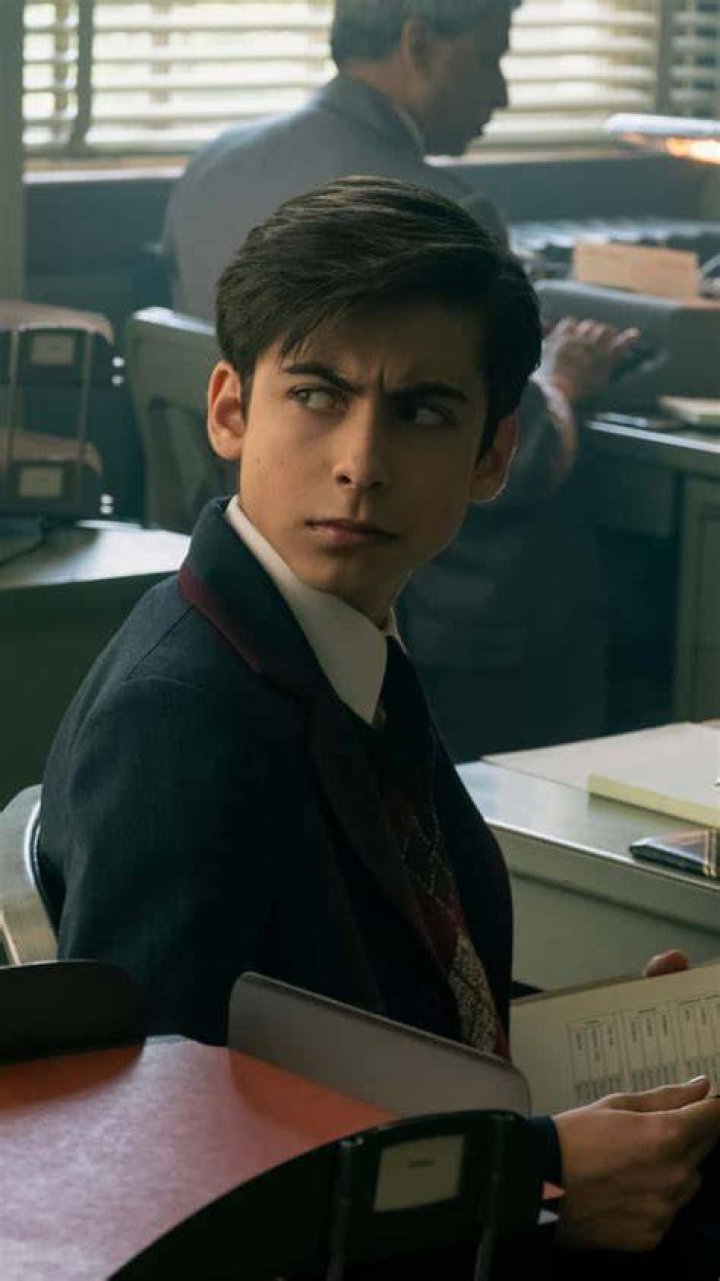Young Aidan Gallagher with his father